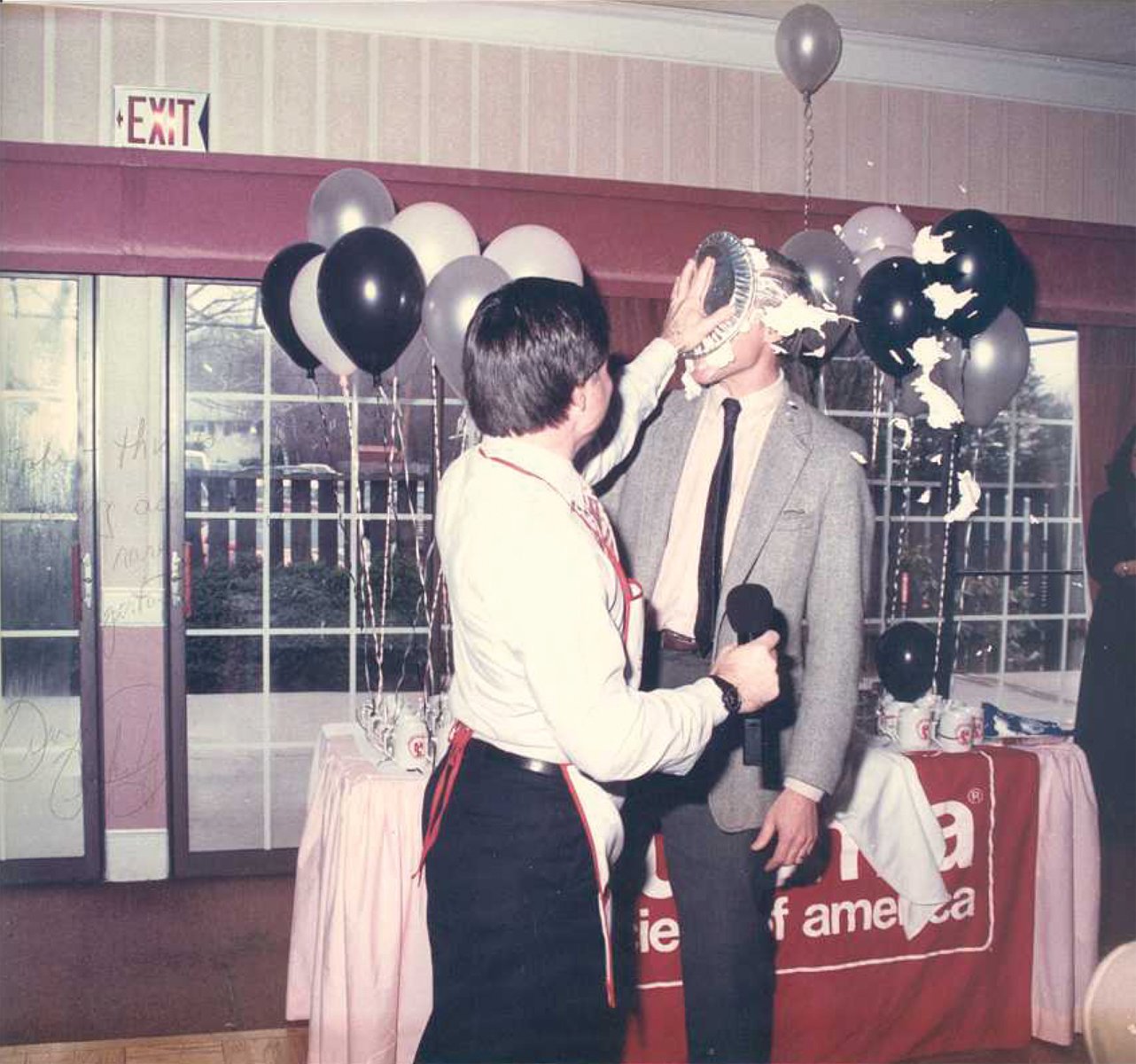 ALL FOR A GOOD CAUSE:  As mayor of Warwick, Francis X. Flaherty often assumed the role of master of ceremonies at nonprofit fundraising events – and as seen here, even threw a pie or two. The recipient is John Howell, who was covering (or, should we say got covered) for the event. 